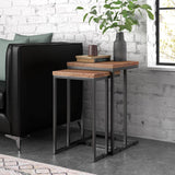 Nesting tables set with wood tops and metal frames, next to a sofa 
